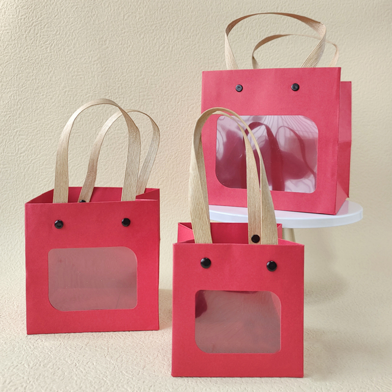 Sacs en papier de cadeau de festival coloré d'artisanat de poignée de rivet avec la fenêtre ouverte