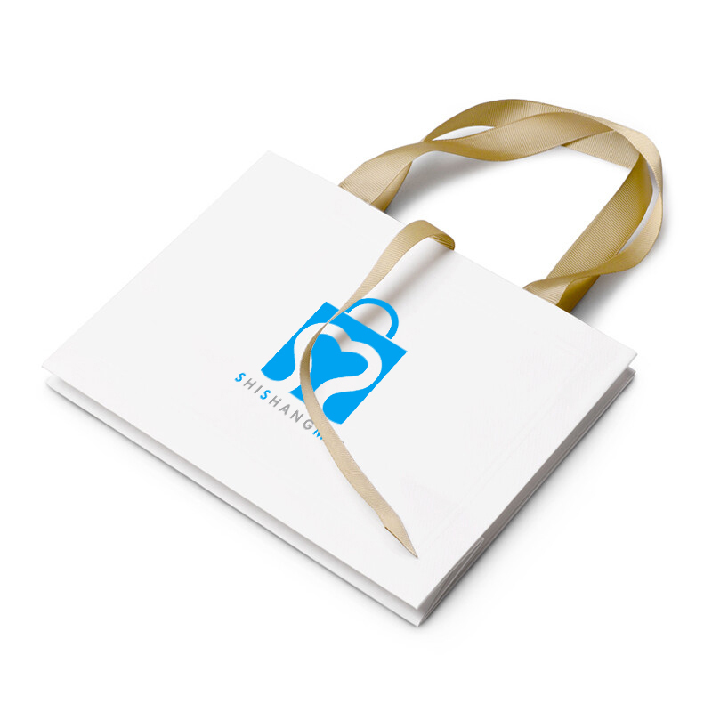 Sacs en papier faits sur commande de bijoux de boutique de luxe avec l'arc de cravate de ruban