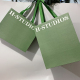 平らなリボン ハンドルが付いている緑のクラフトの服の靴の買い物の紙袋