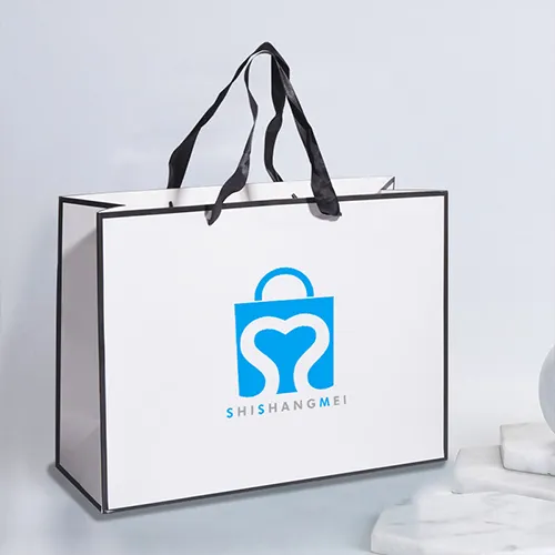 Logotipo personalizado Ropa blanca Zapatos Bolsas de papel con asas de cinta