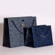 Custom luxury gift clothing cosmetics shopping specialty laser paper bags whoesale premium gift waterproof paper bag embossed