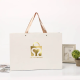 Sacs-cadeaux en papier ruban de luxe en vrac 250gsm avec logo mai fabricants en Chine