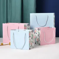 Bolsa de asas europea impresa, embalaje personalizado, bolsa de papel de regalo de compras con lazo de cinta