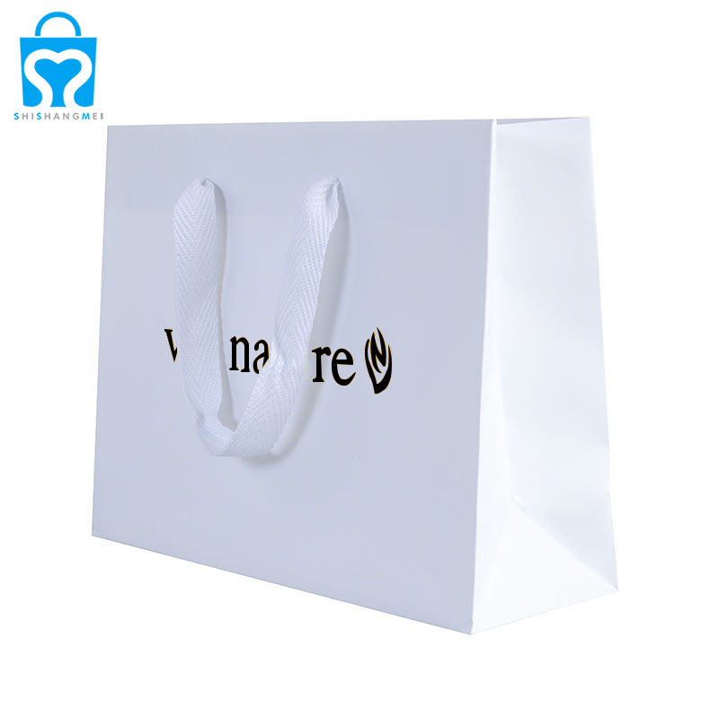 Sacs cadeaux personnalisés en papier blanc avec logo et poignée pour vêtements