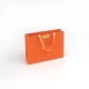 مقبض الشريط البرتقالي مجوهرات حمل حقيبة تسوق التعبئة الورقية مع القوس