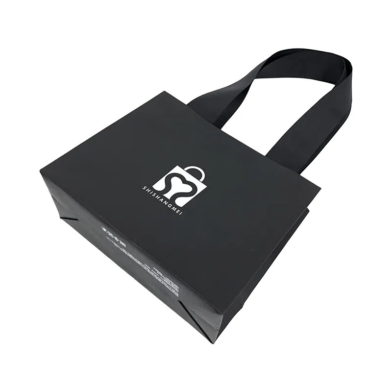 Sacs en papier de conception de luxe personnalisés vêtements bijoux cadeau cosmétique artisanat shopping emballage sac en papier avec poignées en ruban