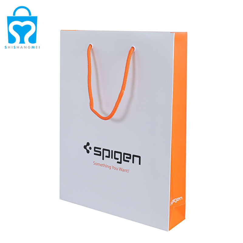 Vêtements jaunes livres cosmétiques documents sac à provisions en papier avec logo