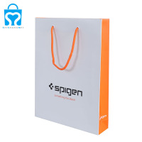 Vêtements jaunes livres cosmétiques documents sac à provisions en papier avec logo