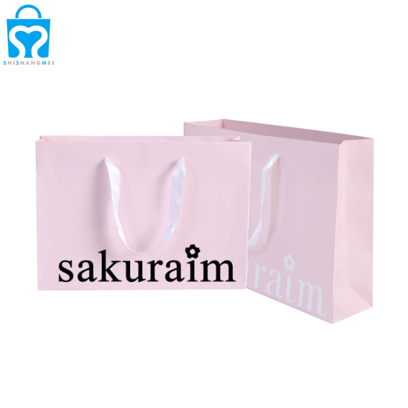 Emballage de sac en papier de magasinage de cosmétiques de chaussures de vêtements réutilisables respectueux de l'environnement avec des sacs d'épicerie imprimés par logo personnalisé