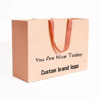 Sac en papier commercial de luxe blanc de haute qualité personnalisé avec emballage de sac cadeau logo avec poignées logo pour vêtements