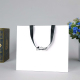 Corda piatta semiautomatica bianca di lusso con manico in nastro boutique artigianale shopping tote bag sacchetti di carta per capelli con logo