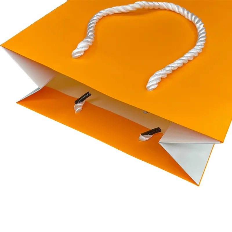 Sacs d'emballage en papier de luxe pour le shopping, avec logo imprimé, sac cadeau pour cheveux cosmétiques pour vêtements orange pour petites entreprises