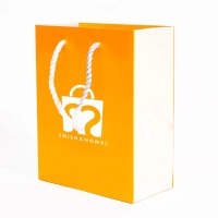 Sacs d'emballage en papier de luxe pour le shopping, avec logo imprimé, sac cadeau pour cheveux cosmétiques pour vêtements orange pour petites entreprises