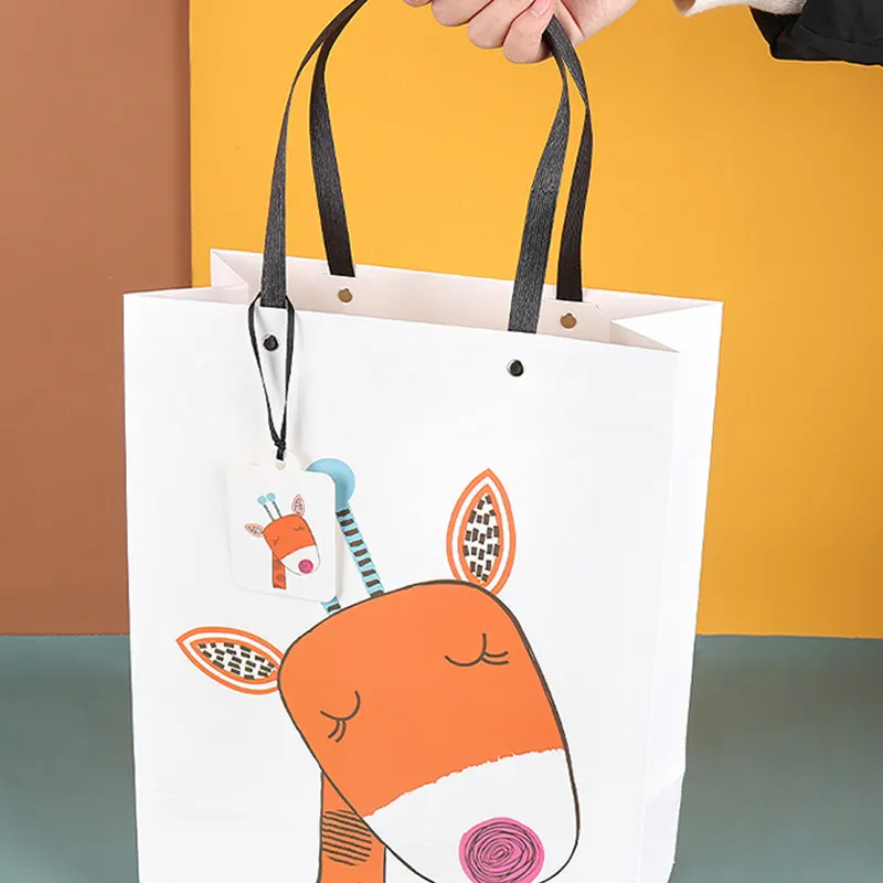 Özel logo lüks pembe yeşil hediye bolsas kağıt alışveriş taşıma takı perakende karikatür kağıt hediye çantası logolu taşıma çantası