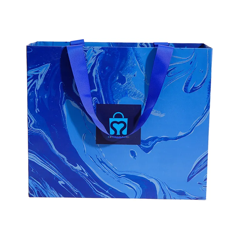 Cadeau de magasinage de boutique de détail bleu marine de luxe personnalisé portant un sac en papier avec votre propre poignée de ruban de logo pour l'emballage cadeau