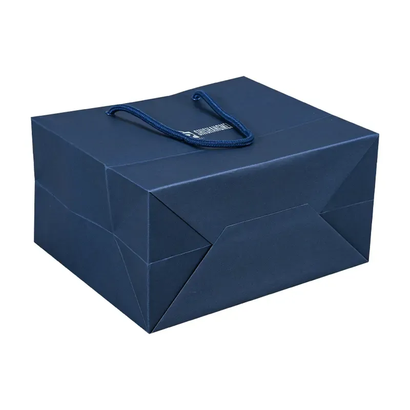 Feuille métallique de luxe réutilisable estampage promotionnel bleu marine bijoux emballage shopping sacs-cadeaux en papier