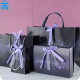 Bolsa de transporte de papel de compras púrpura de joyería de lujo con impresión personalizada al por mayor con asas de lazo de cinta embalaje de bolsa de regalo impreso con logotipo
