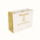 ゴールドの光沢のあるラミネーション カスタム印刷トート ブランド ジュエリー ギフト包装紙ショッピング バッグ ハンドル ロゴが印刷されたテイクアウト