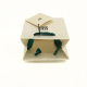Small white gift paper recyclable golf bag packaging with name tag green ribbon handles for jewelry decorative package