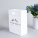 Eco recyclable europe promotionnel logo personnalisé die cut poignée blanc vêtements cadeau sac à provisions en papier avec votre propre logo