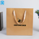 Recyclable High end soft lamination embross logo luxury product brown craft small shopping paper gift bags ribbon handles