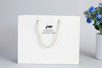 Sac en papier artisanal coco kids party impression poignée de corde torsadée pour l'emballage de shopping