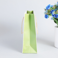 Sac en papier artisanal coco kids party impression poignée de corde torsadée pour l'emballage de shopping