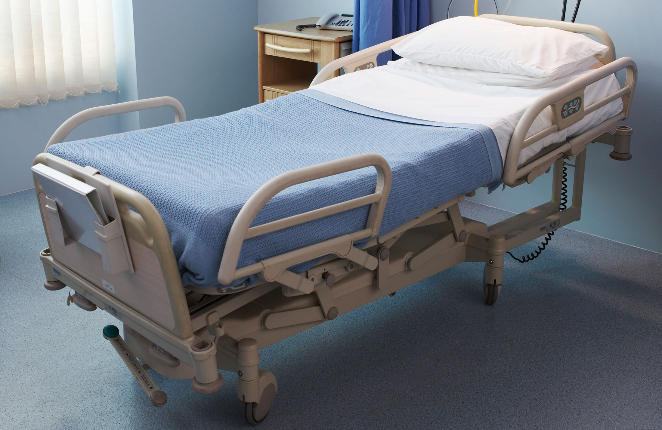 Is a hospital patient bed better than an adjustable bed?