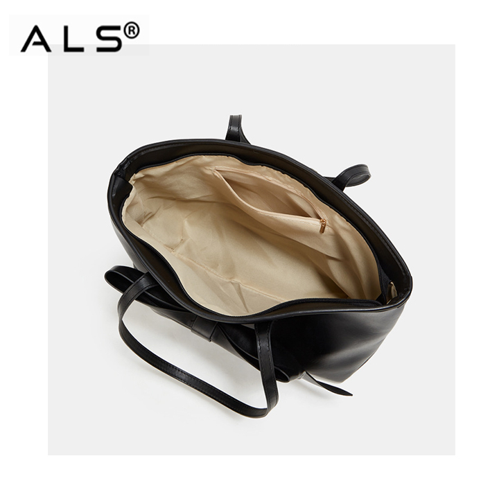 Bolsa de mano con diseño de lazo