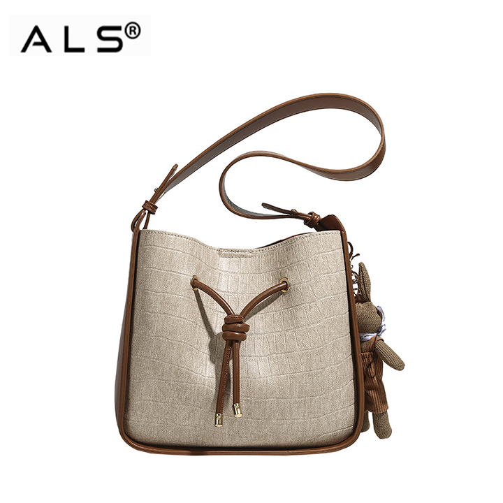 Bolso de cuero tipo cubo con cordón ajustable en combinación marrón y blanco