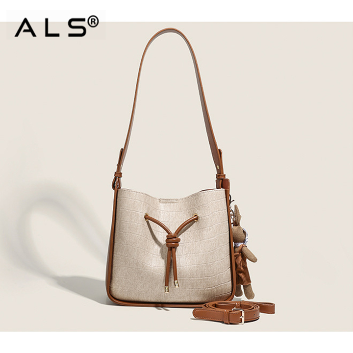 Bolso de cuero tipo cubo con cordón ajustable en combinación marrón y blanco