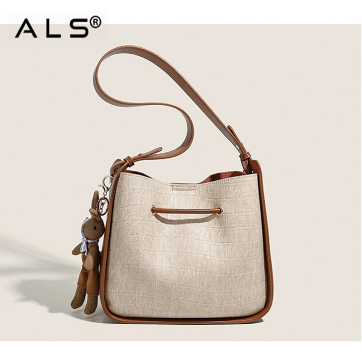 Bolso de cuero tipo cubo con cordón ajustable en combinación marrón y blanco