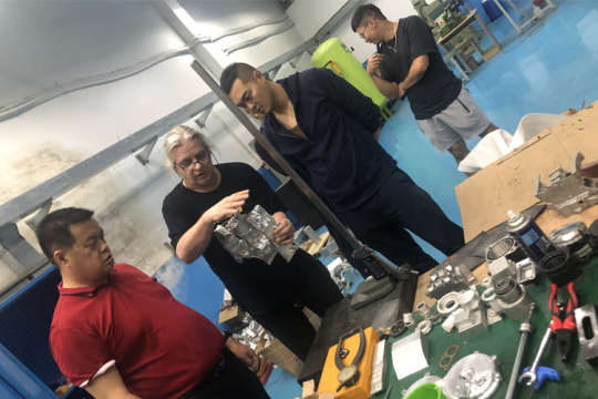 Discuss technology with German engineers