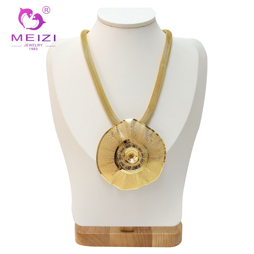 gold pendant set with earrings