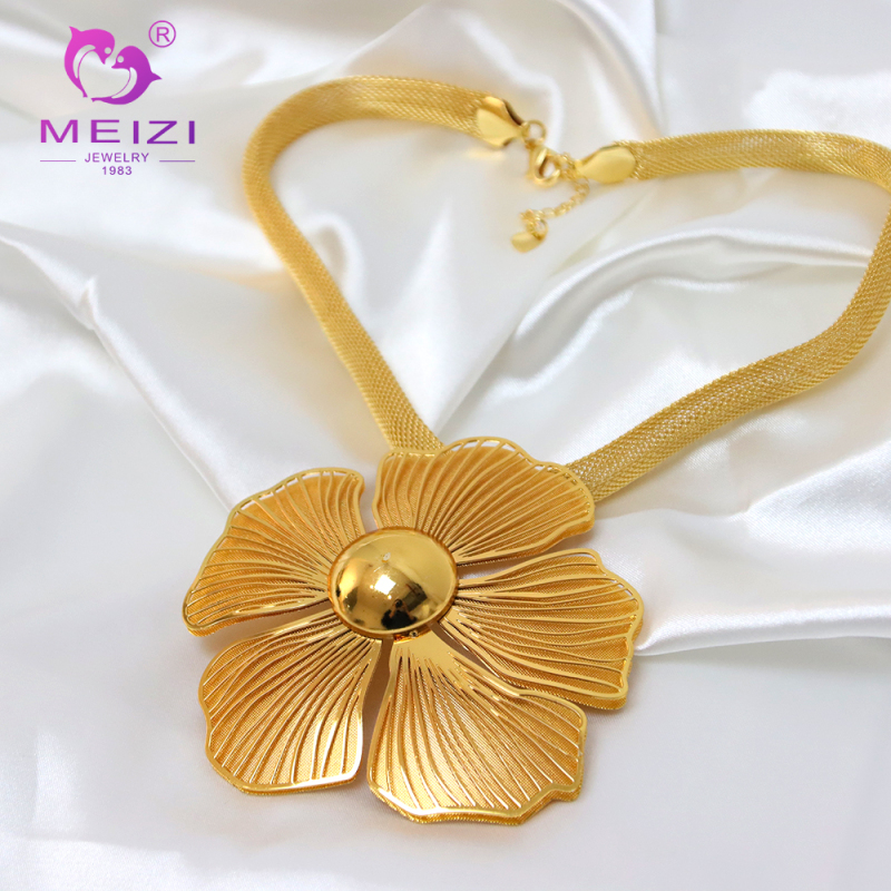 women's gold pendant set necklace and earring set