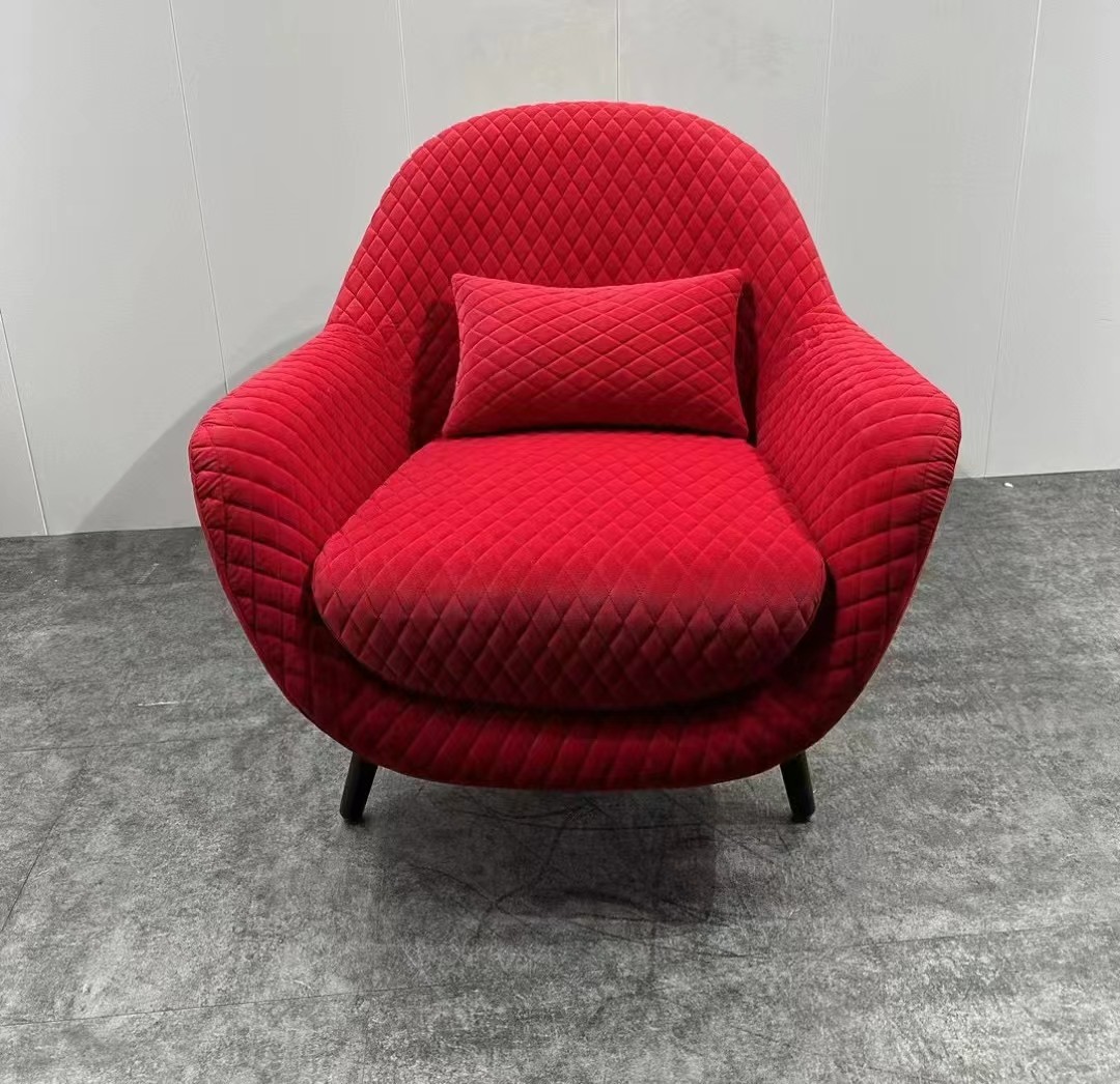 red armchair with metal pedal