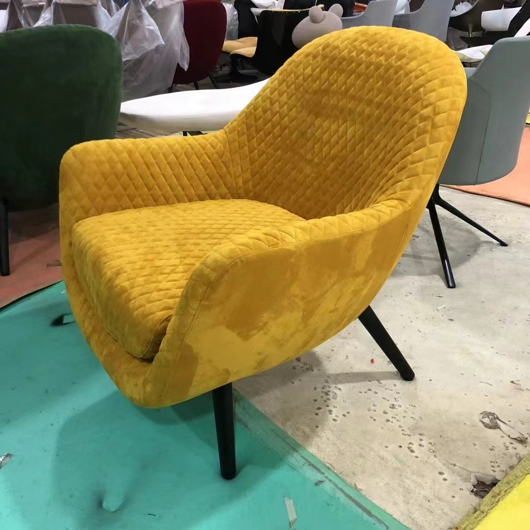 red armchair with metal pedal