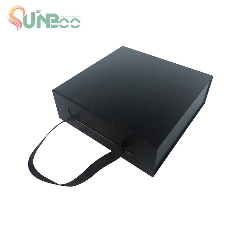 Boîte pliante à poignée noire pour emballage cadeau avec ruban adhésif et aimant