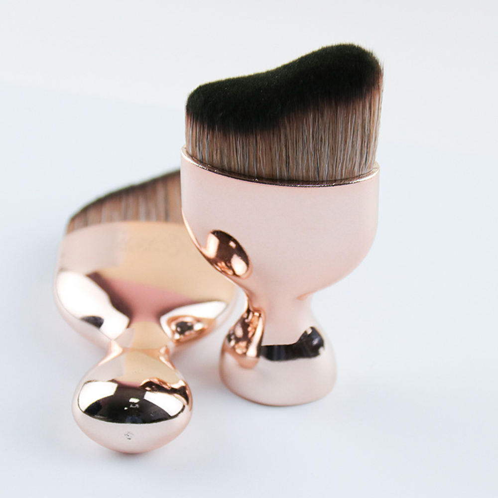 Rose gold face tanning brushes with curved head bristles for face tanning