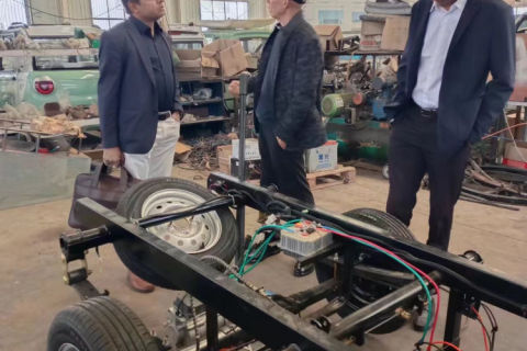 Indian customers come to the factory to negotiate electric transport vehicles and micro trucks