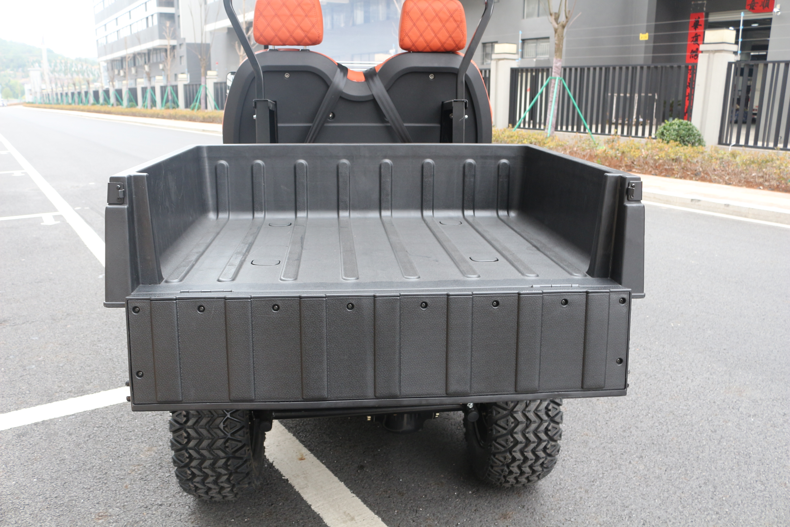 Electric golf cart with cargo box for transport