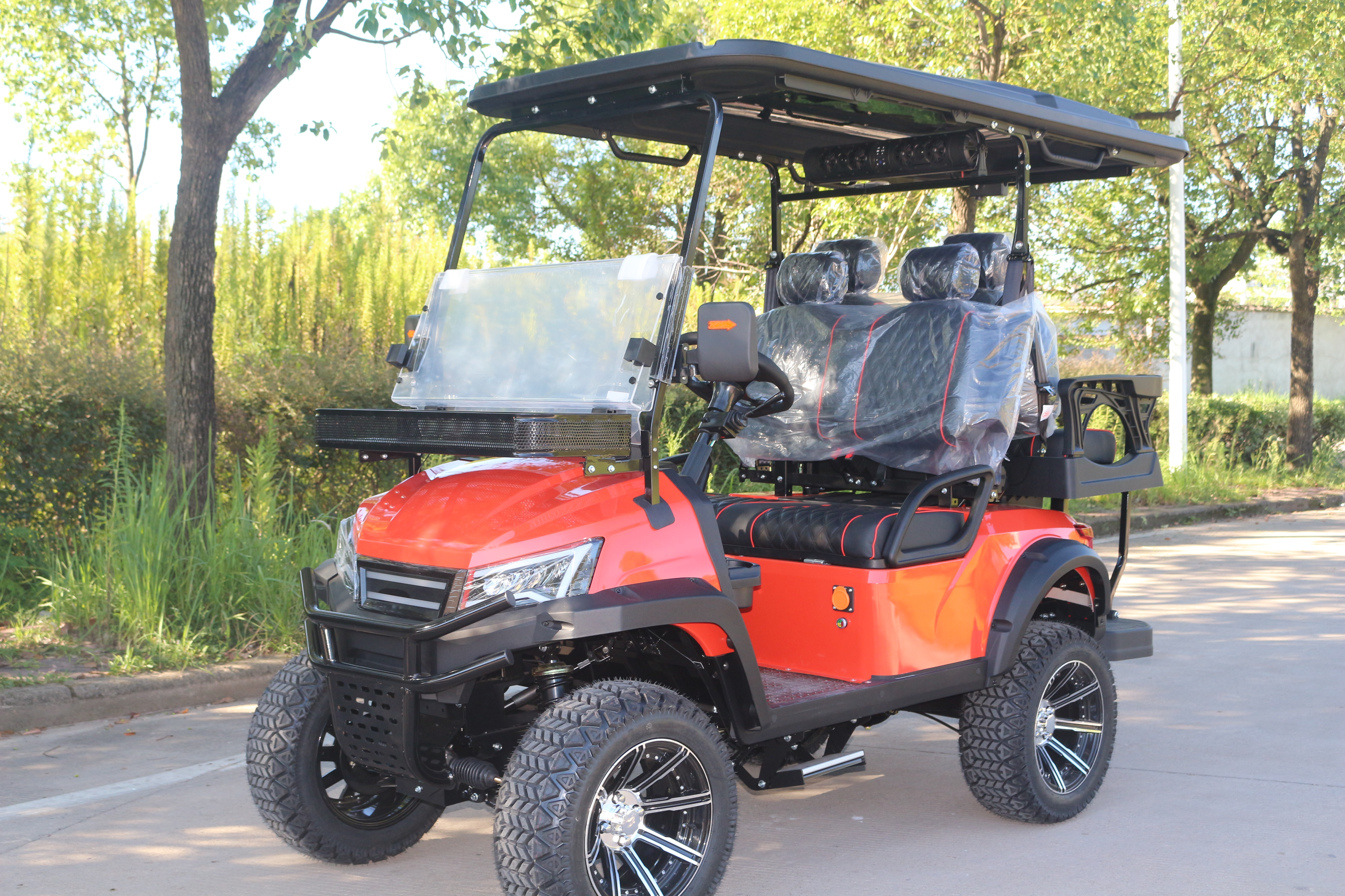 Heavy-Duty Red Electric Golf Vehicle with Rugged Tires, Perfect for Golf and Off-Road Exploration