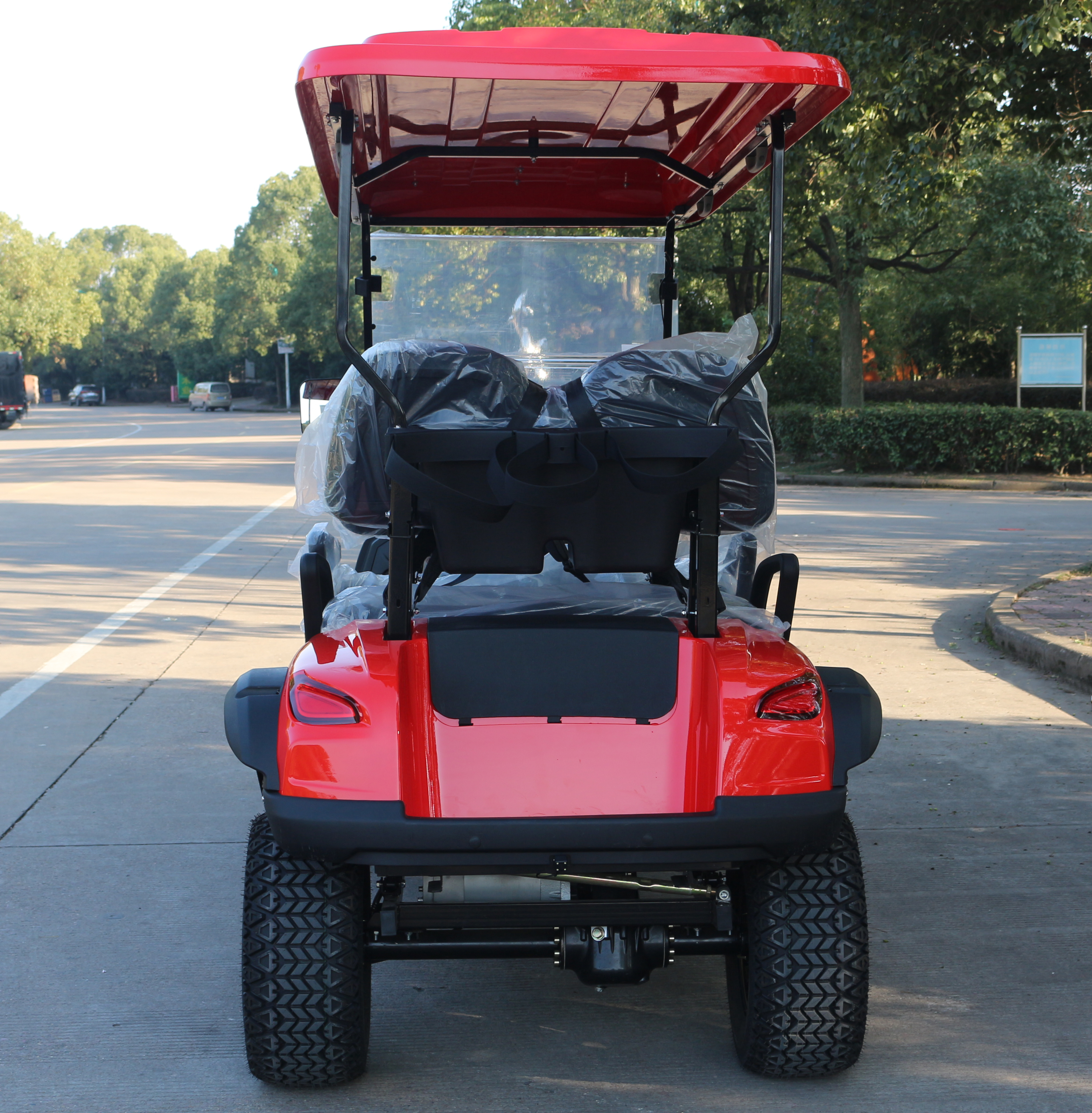 Red 4-Seat Golf Cart with Off-Road Tires for Resort Shuttles