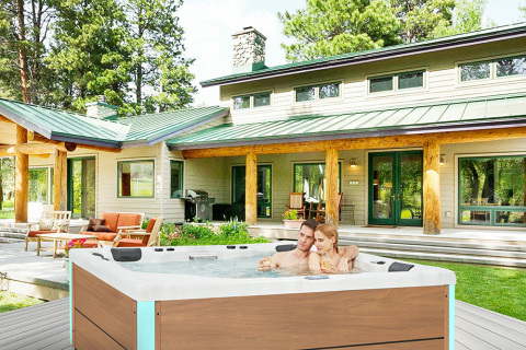 How can an outdoor hot tub add a touch of atmosphere to a courtyard dinner?