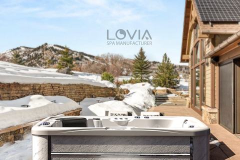 Do winter temperatures affect the operation of an outdoor hot tub?
