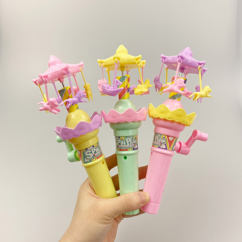 High Quality Hand Operated Merry-go-round Candy Toy With Hand Shake Lamp Light Plastic Carousel Toy Candy