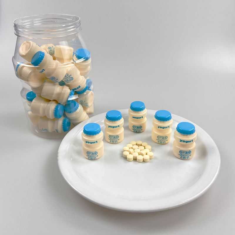 Yogurt flavor tablet candy packed in small yogurt bottle shaped in big yogurt jar