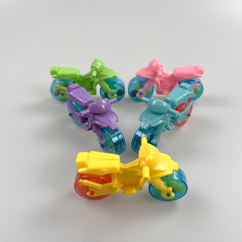 Motorbike shaped toy with multicolored fruity hard candy