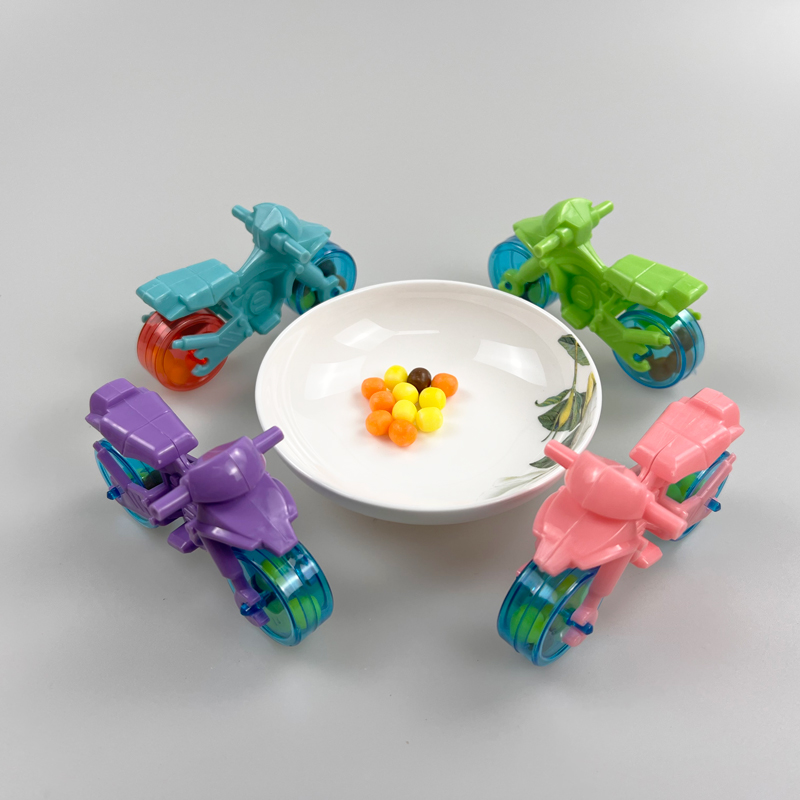 Motorbike shaped toy with multicolored fruity hard candy