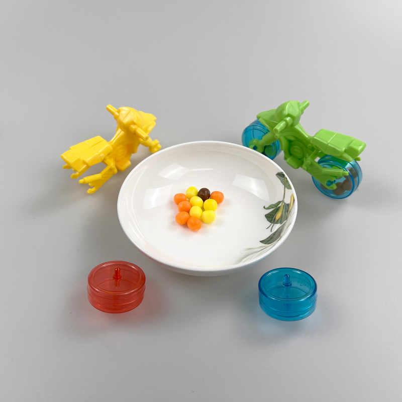 Motorbike shaped toy with multicolored fruity hard candy